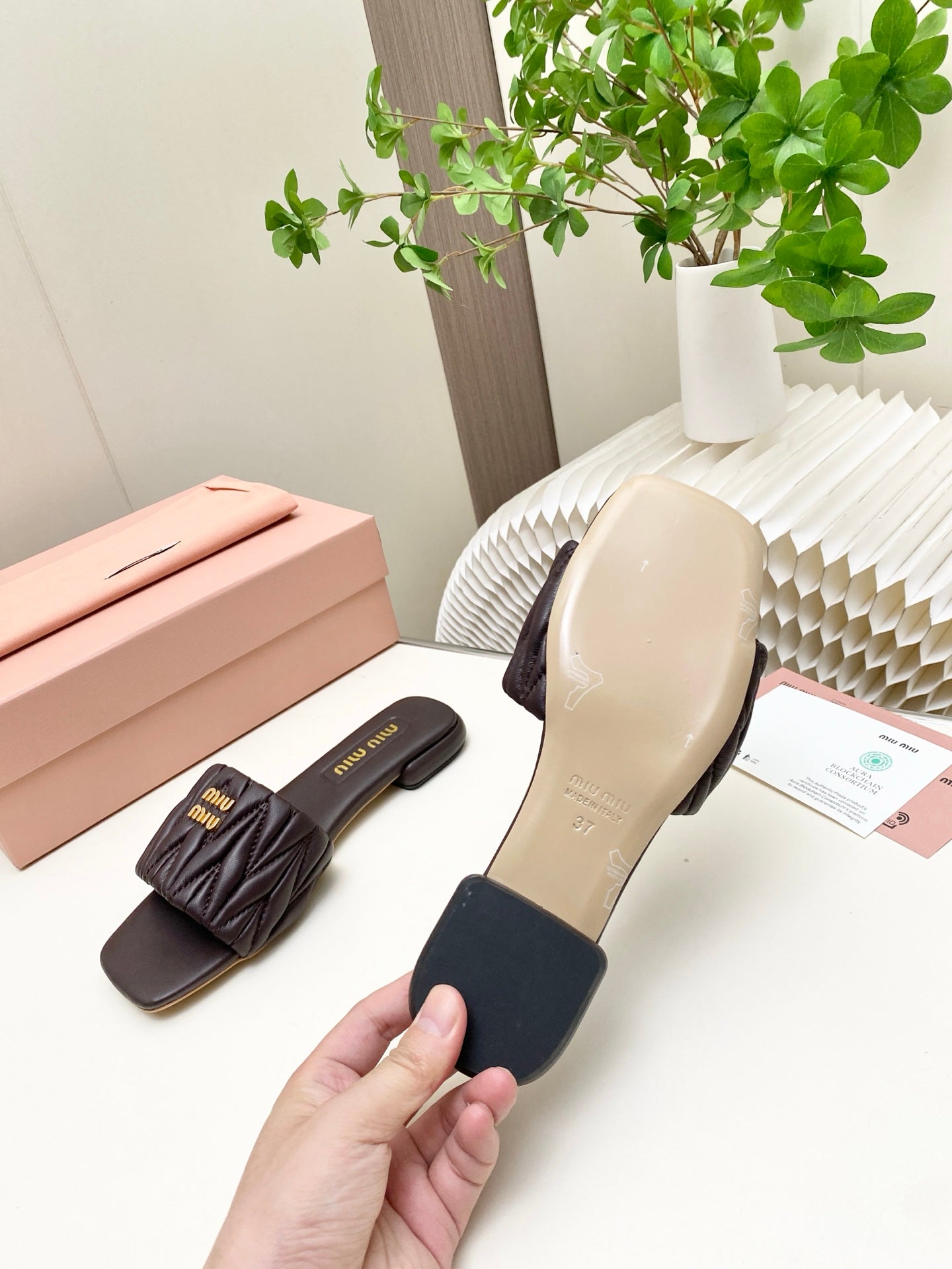 MIUMIU 26S MATELASSE SLIDES IN DARK BROWN CALFSKIN