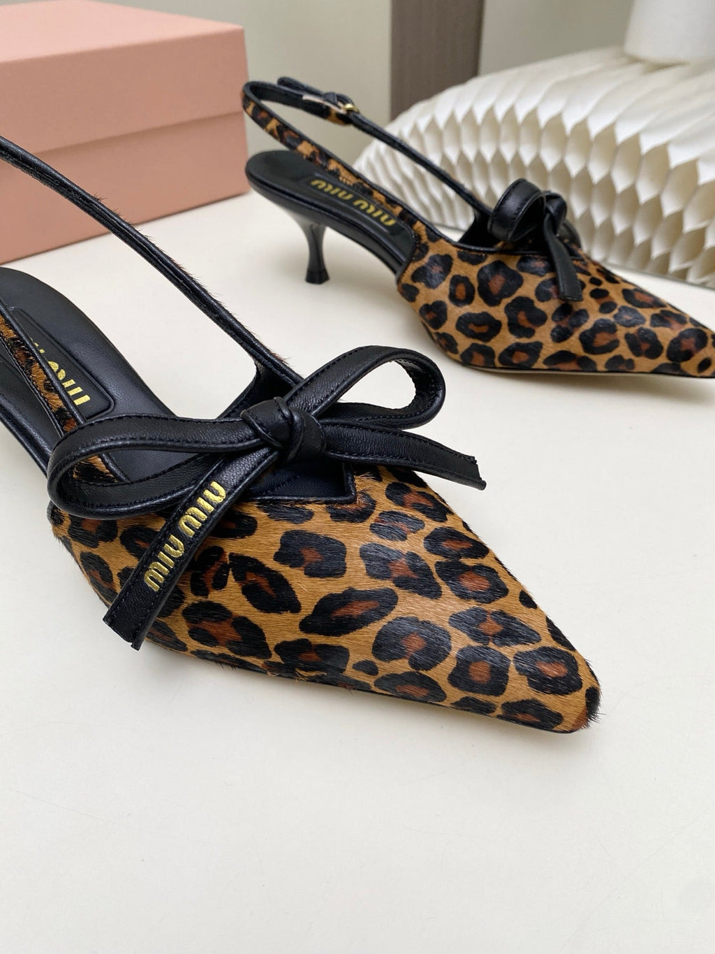 MIUMIU 26S SLINGBACK PUMPS 55MM IN LEOPARD PRINT CALF HAIR WITH BOW