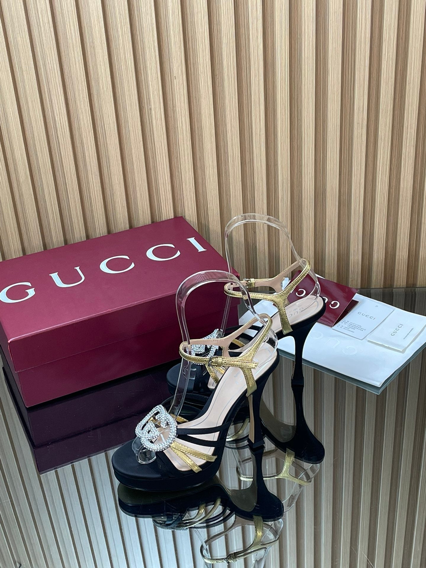GUCCI 26S HIGH-HEELED SANDALS 125 MM IN BLACK SATIN AND GOLD CALFSKIN