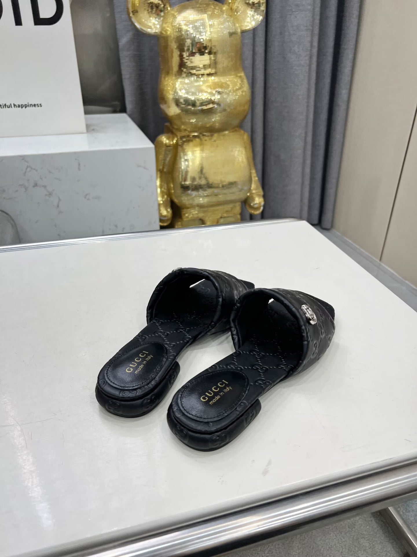 GG CASUAL SLIPPERS IN BLACK CALFSKIN LOGO EMBOSSING