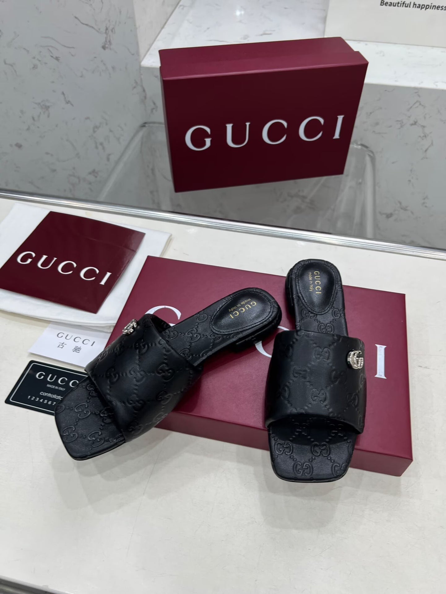 GG CASUAL SLIPPERS IN BLACK CALFSKIN LOGO EMBOSSING