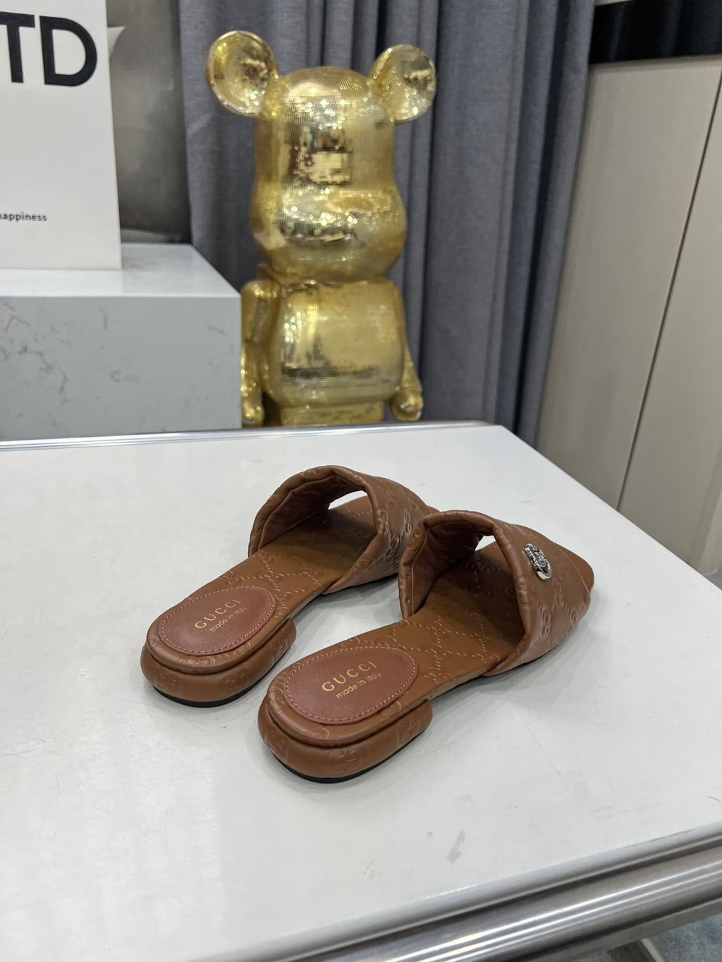 GG CASUAL SLIPPERS IN BROWN CALFSKIN LOGO EMBOSSING