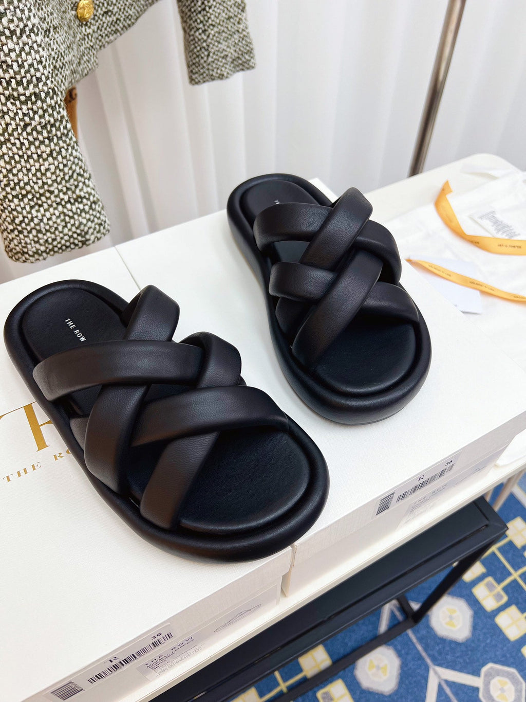 THE ROW 26S CROSSED PADDED SLIDES IN BLACK CALFSKIN