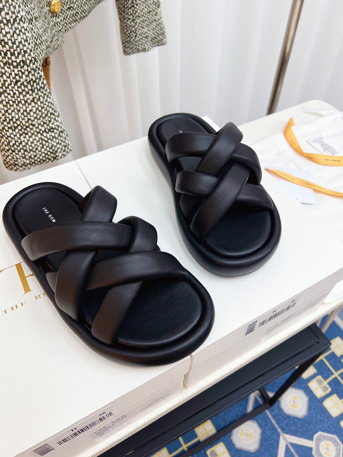 THE ROW 26S CROSSED PADDED SLIDES IN BLACK CALFSKIN
