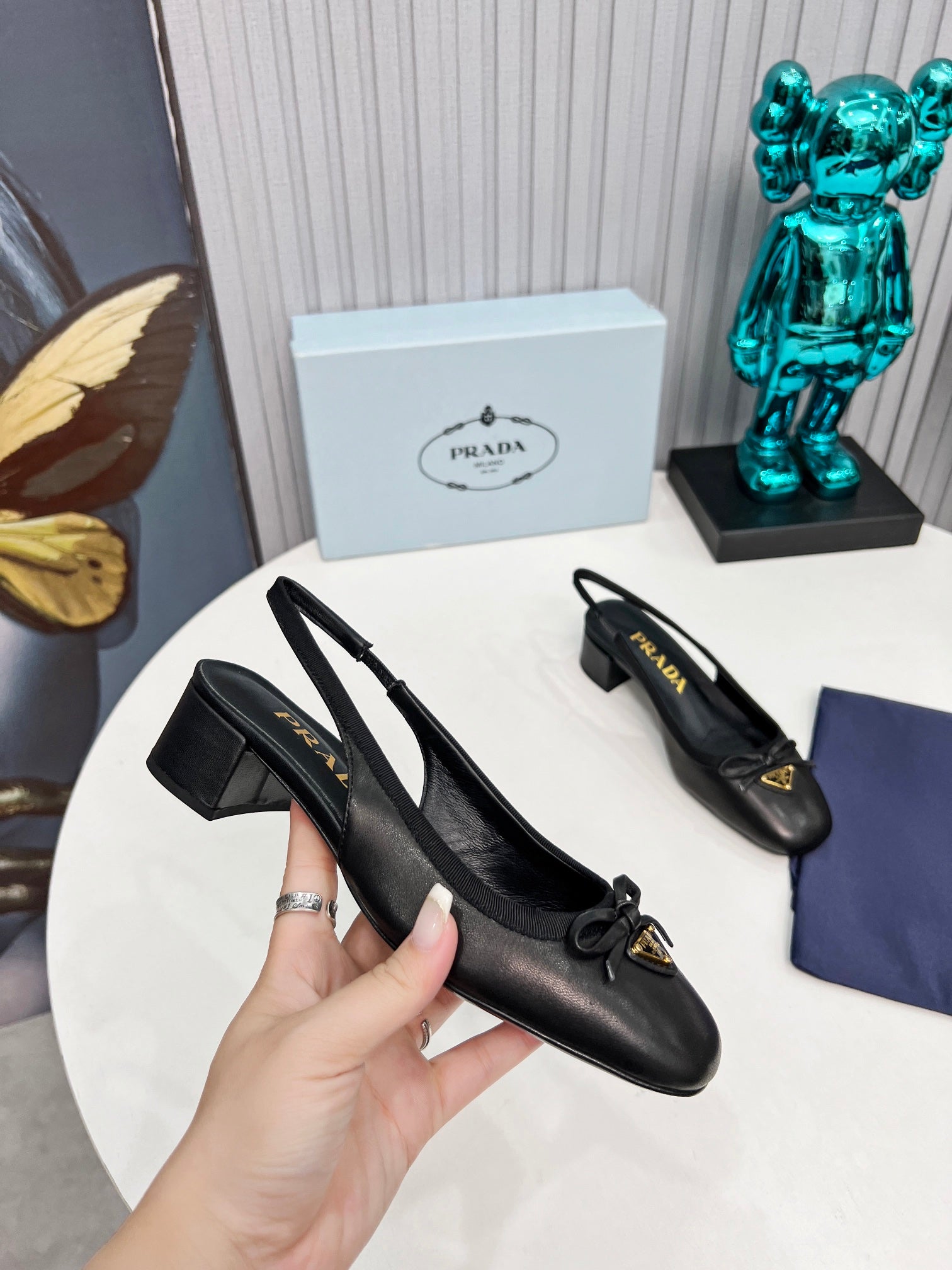 PRADA 26S ROUND TOE SLINGBACK PUMPS 40MM IN BLACK CALFSKIN WITH BOW