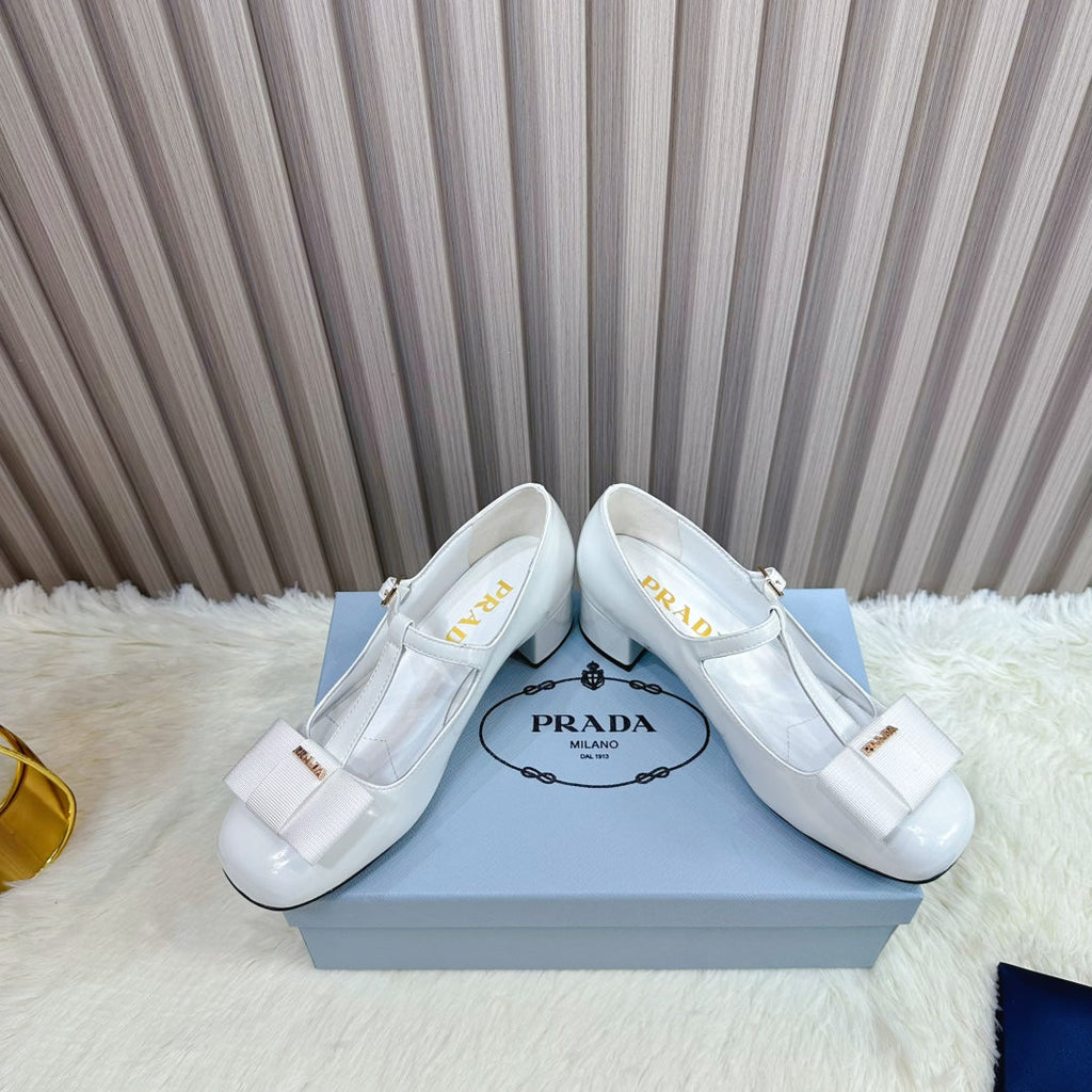 PRADA 26S T-STRAP MARY JANE PUMPS 40MM IN LIGHT BLUE PATENT CALFSKIN WITH BOW
