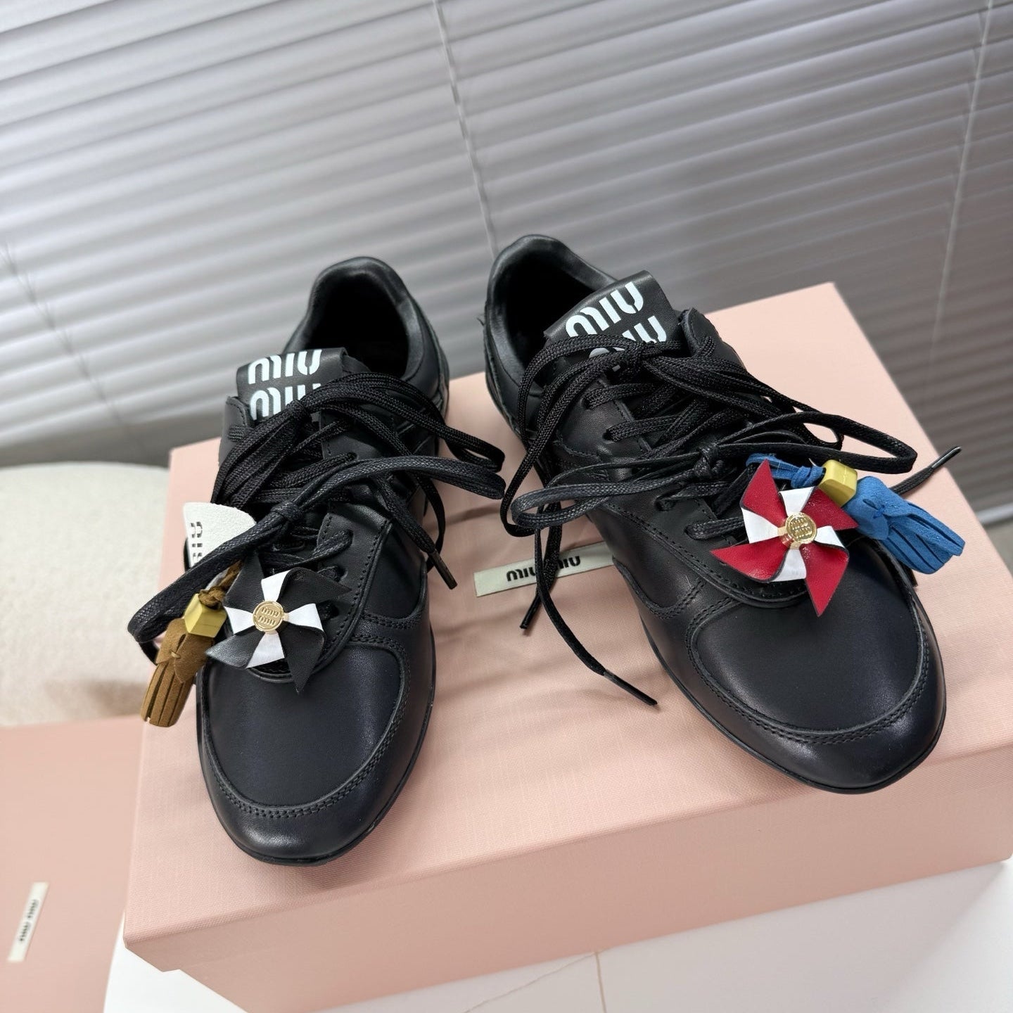 MIUMIU 26S GYMNASIUM SNEAKER IN BLACK CALFSKIN WITH GOLD BUCKLED STRAP
