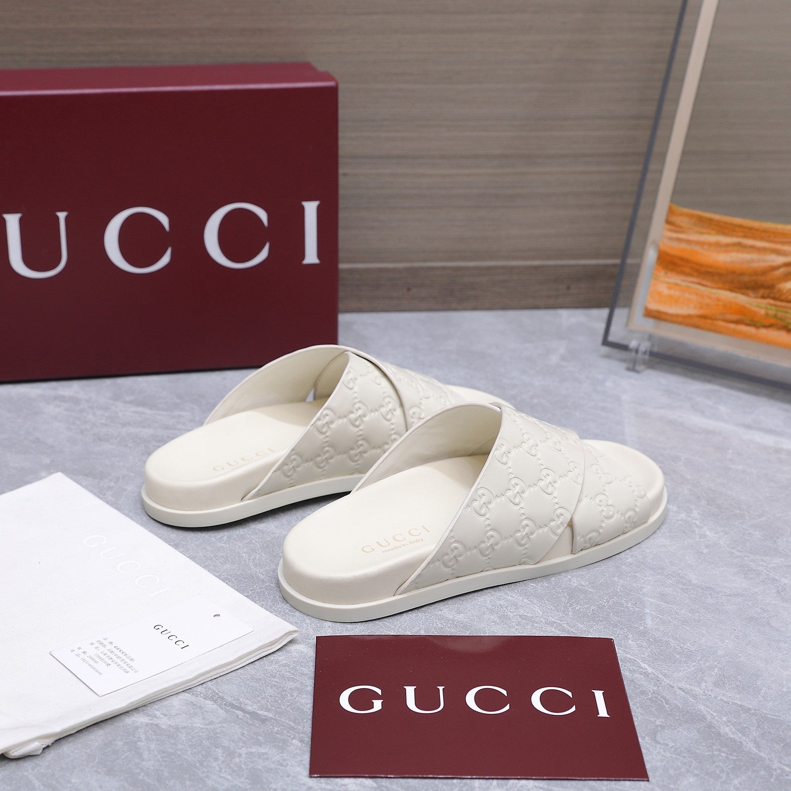 GUCCI 26S CROSSOVER SANDALS IN WHITE GG EMBOSSED CALFSKIN