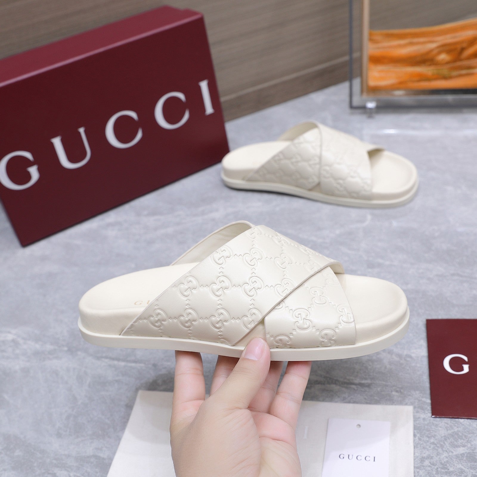 GUCCI 26S CROSSOVER SANDALS IN WHITE GG EMBOSSED CALFSKIN