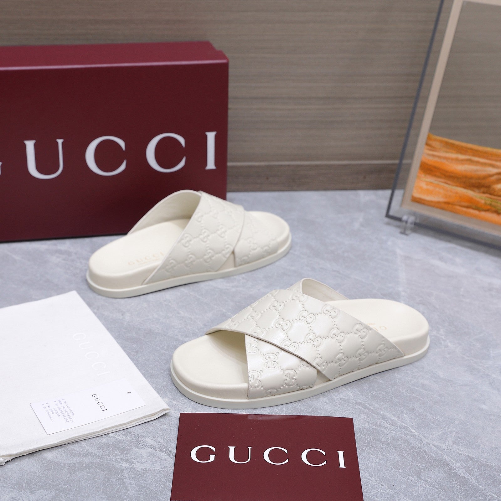 GUCCI 26S CROSSOVER SANDALS IN WHITE GG EMBOSSED CALFSKIN