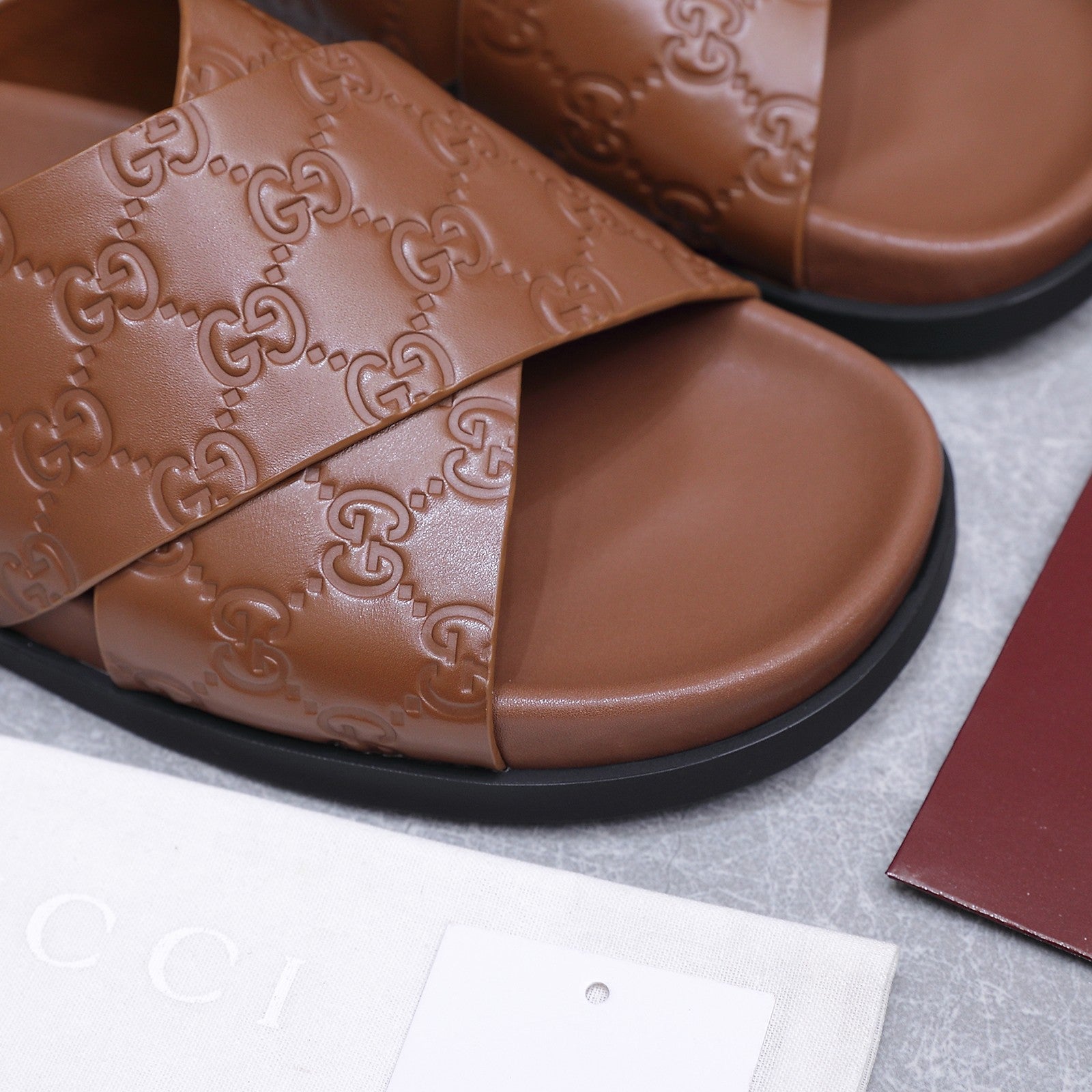 GUCCI 26S CROSSOVER SANDALS IN CARAMEL BROWN GG EMBOSSED CALFSKIN