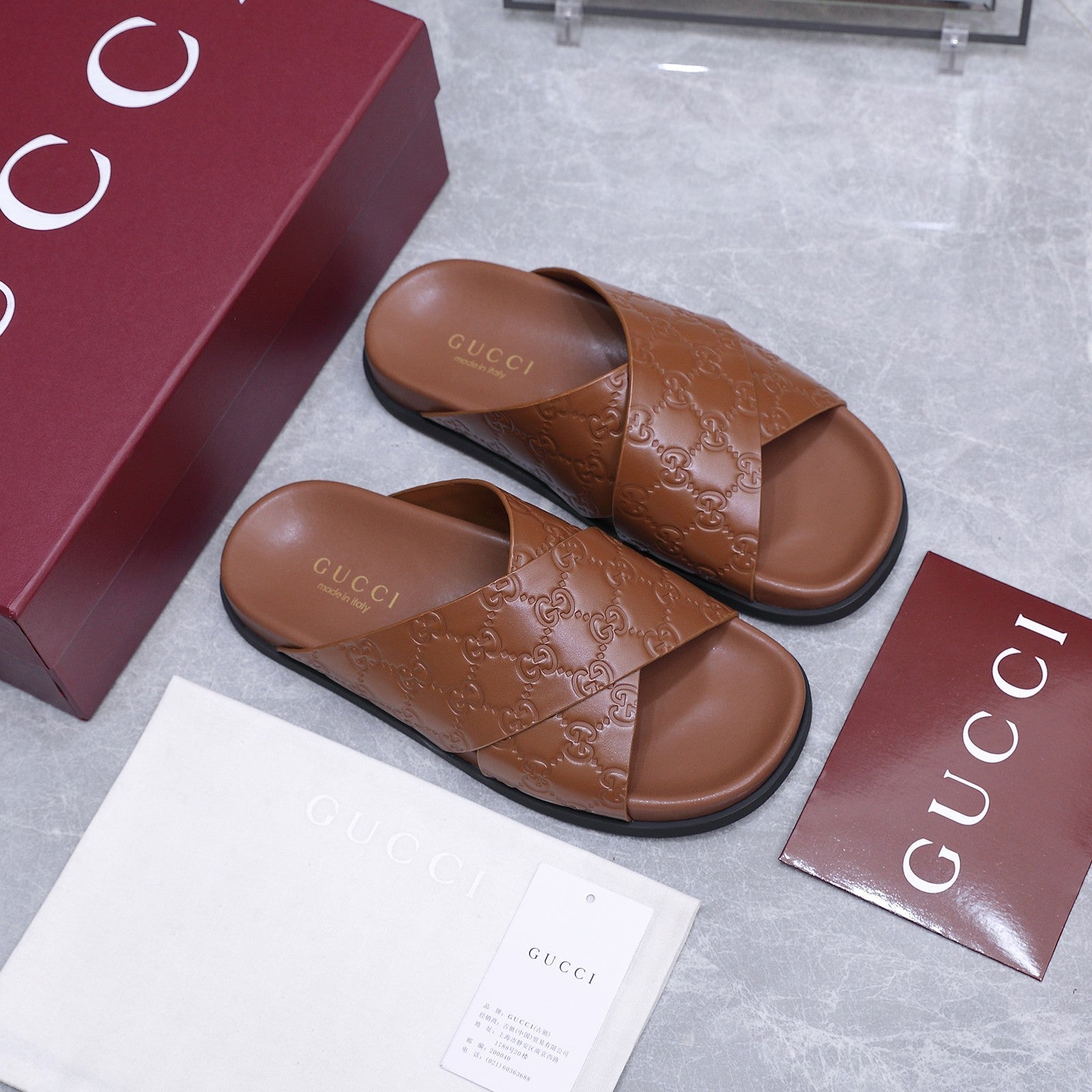 GUCCI 26S CROSSOVER SANDALS IN CARAMEL BROWN GG EMBOSSED CALFSKIN