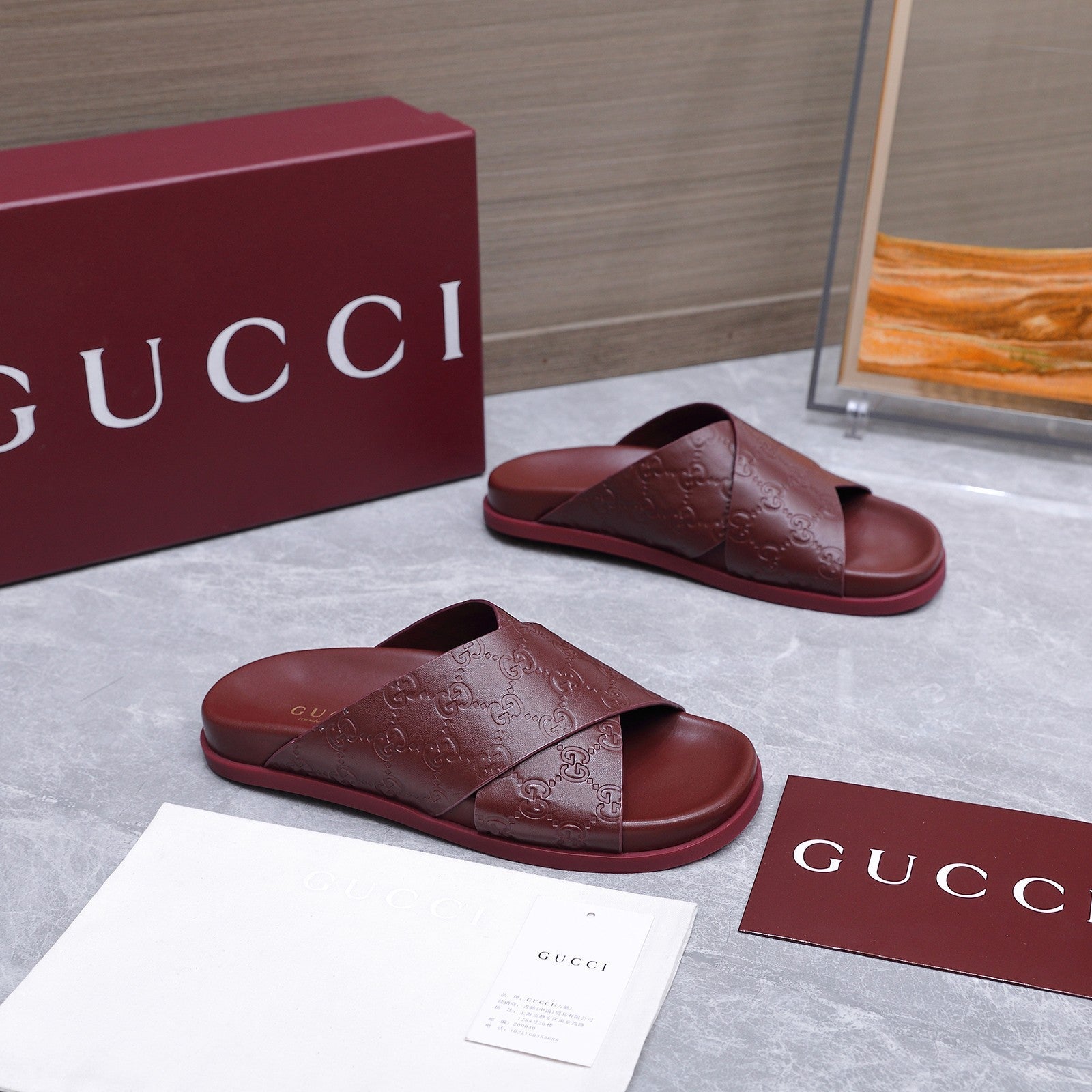 GUCCI 26S CROSSOVER SANDALS IN BURGUNDY RED GG EMBOSSED CALFSKIN