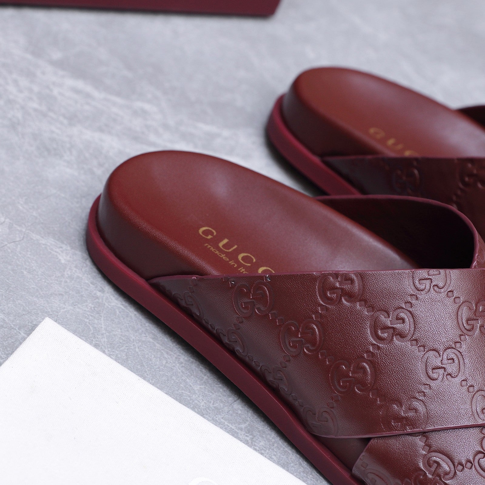 GUCCI 26S CROSSOVER SANDALS IN BURGUNDY RED GG EMBOSSED CALFSKIN