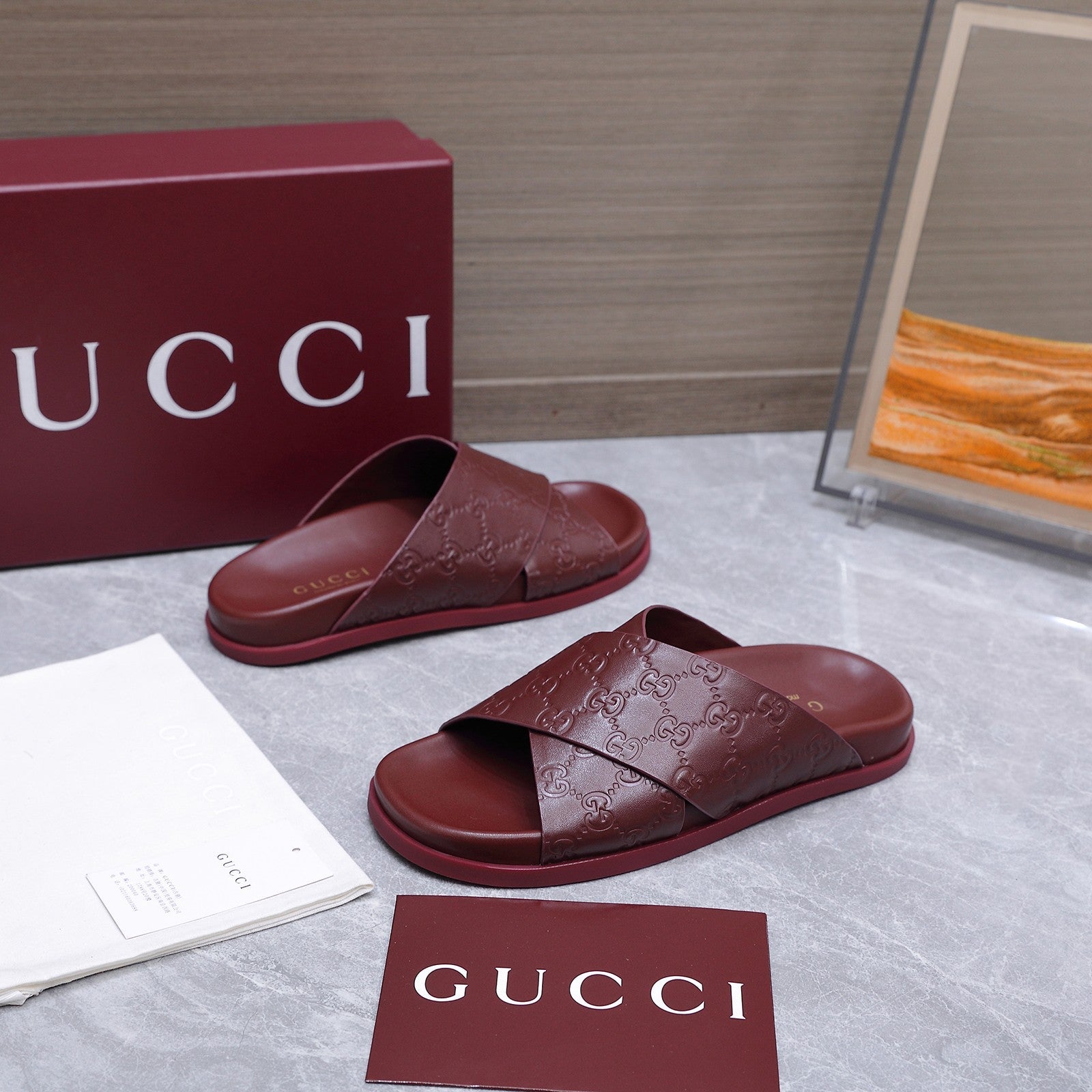 GUCCI 26S CROSSOVER SANDALS IN BURGUNDY RED GG EMBOSSED CALFSKIN