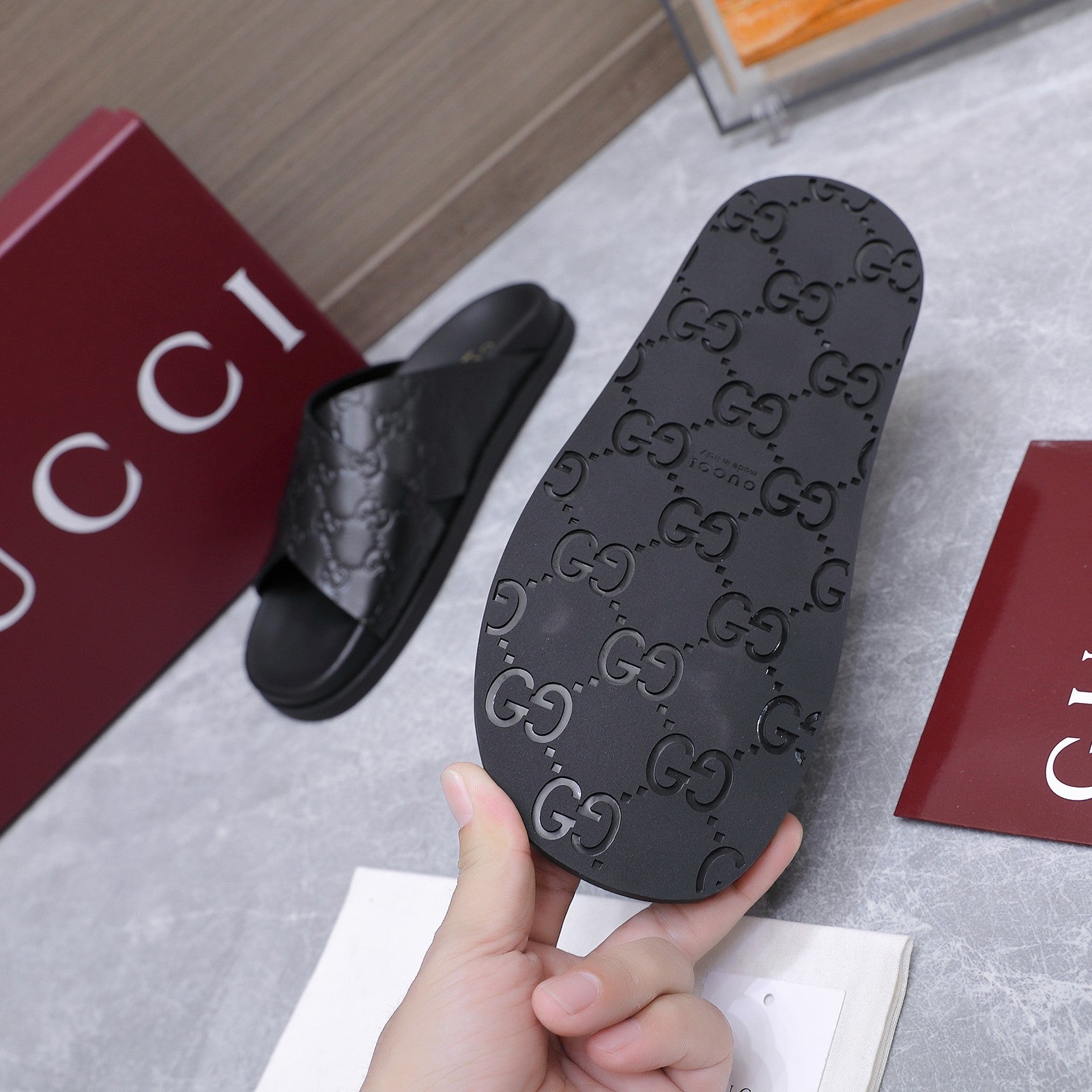 GUCCI 26S CROSSOVER SANDALS IN BLACK GG EMBOSSED CALFSKIN