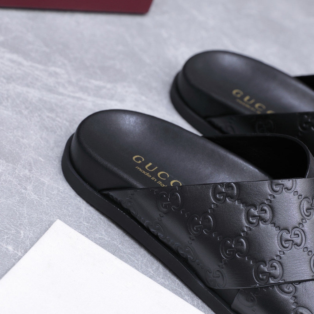 GUCCI 26S CROSSOVER SANDALS IN BLACK GG EMBOSSED CALFSKIN