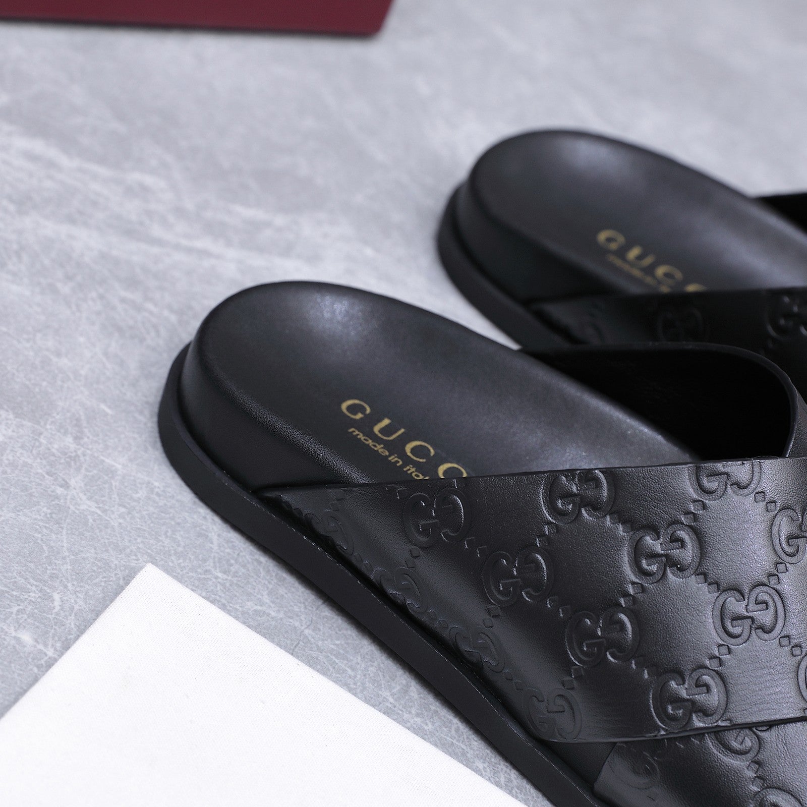 GUCCI 26S CROSSOVER SANDALS IN BLACK GG EMBOSSED CALFSKIN