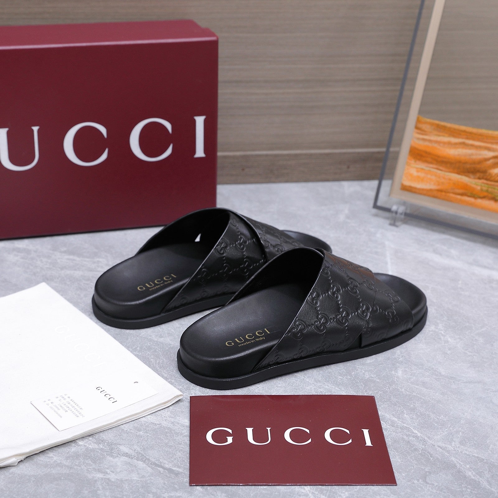GUCCI 26S CROSSOVER SANDALS IN BLACK GG EMBOSSED CALFSKIN