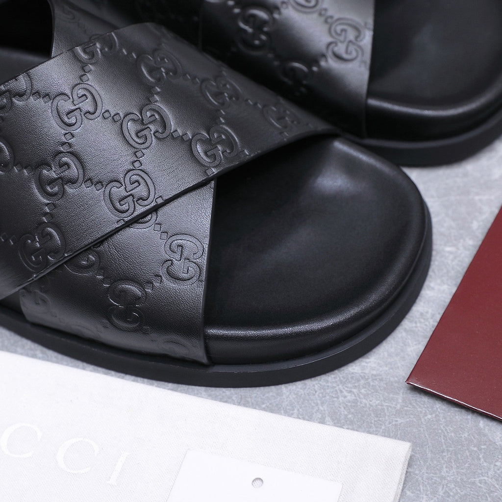 GUCCI 26S CROSSOVER SANDALS IN BLACK GG EMBOSSED CALFSKIN