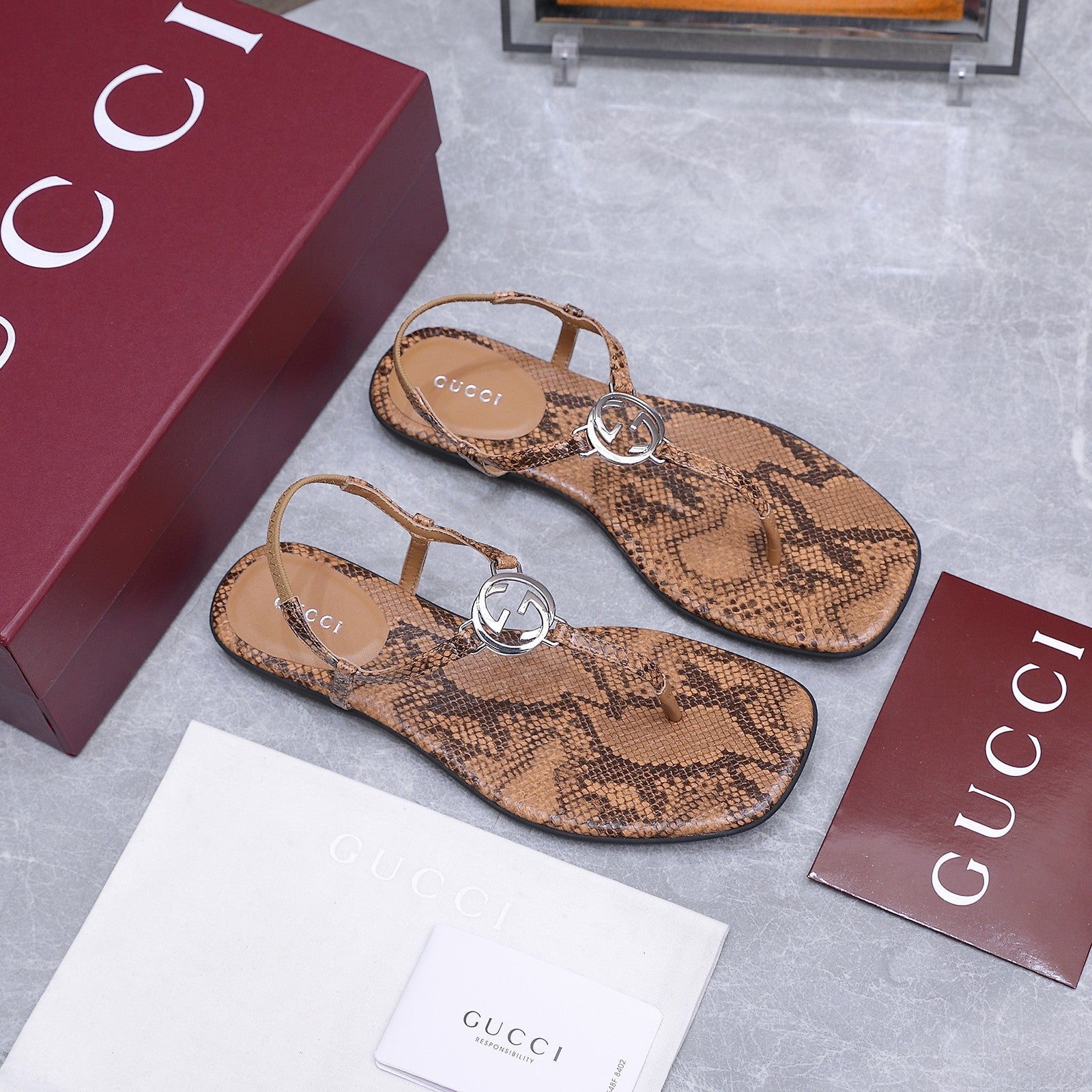 GUCCI 26S INTERLOCKING G THONG SANDALS IN BROWN PYTHON PRINT CALFSKIN
