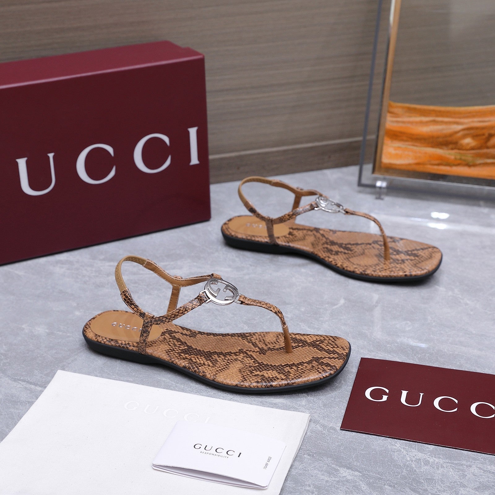 GUCCI 26S INTERLOCKING G THONG SANDALS IN BROWN PYTHON PRINT CALFSKIN