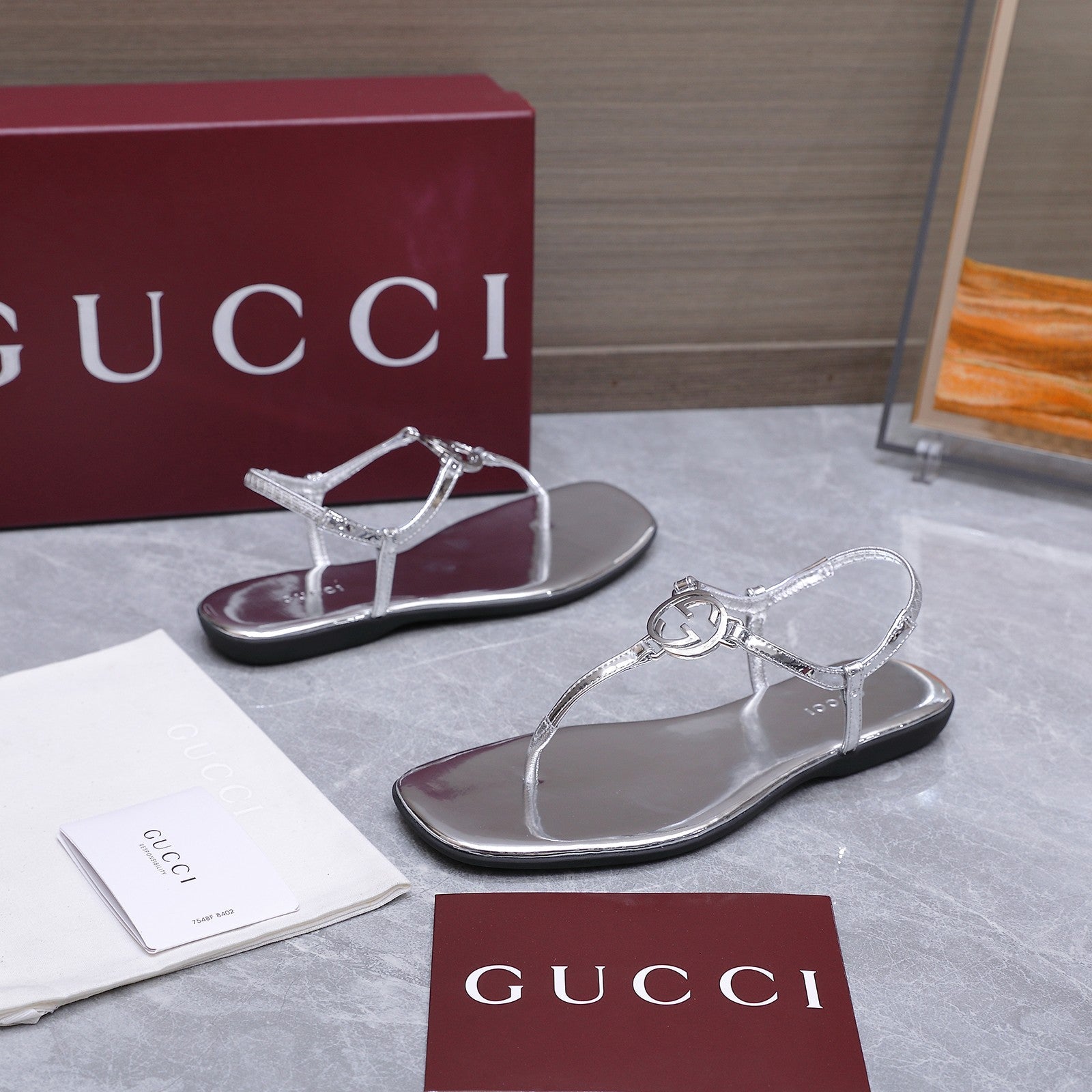 GUCCI 26S INTERLOCKING G THONG SANDALS IN SILVER CALFSKIN