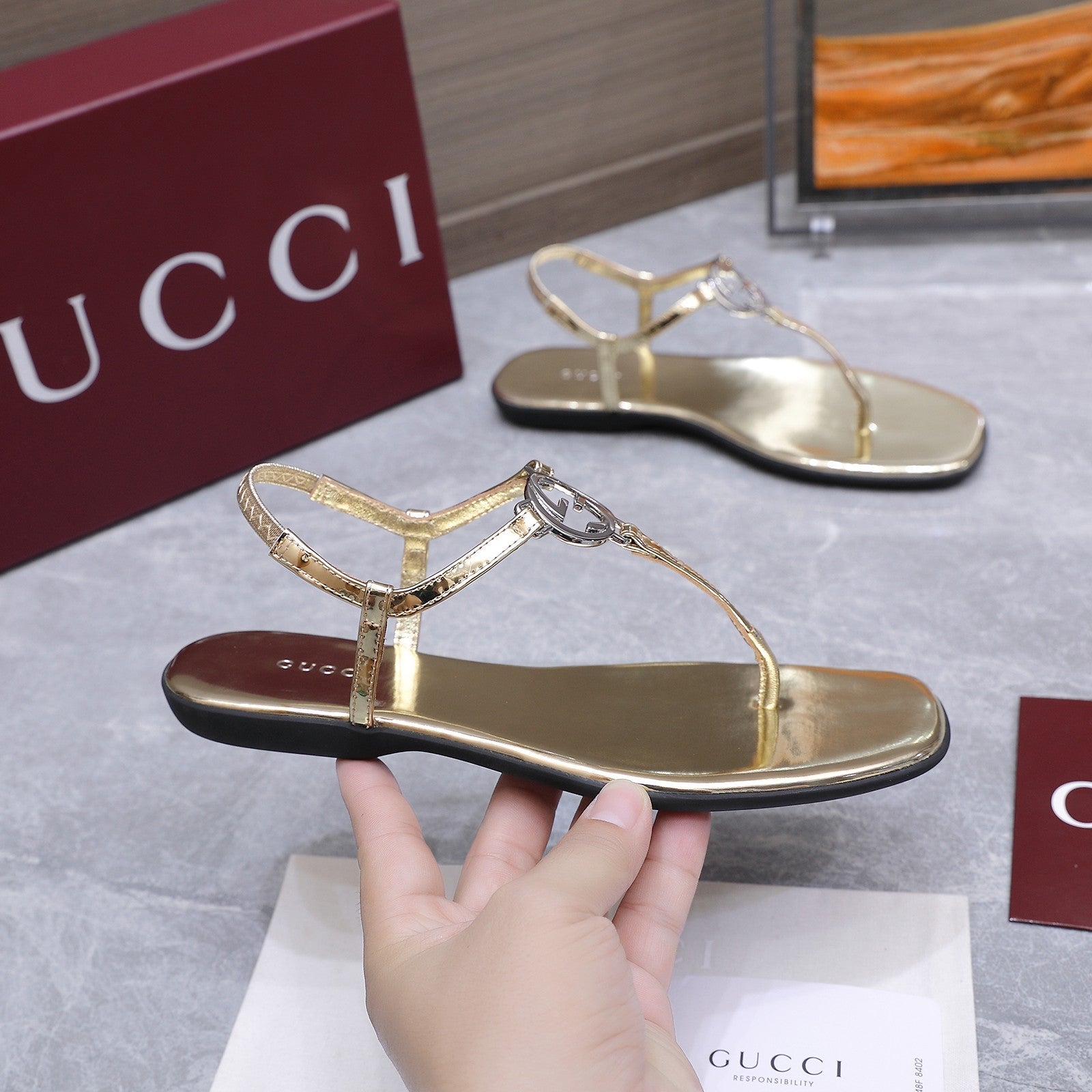 GUCCI 26S INTERLOCKING G THONG SANDALS IN GOLD CALFSKIN