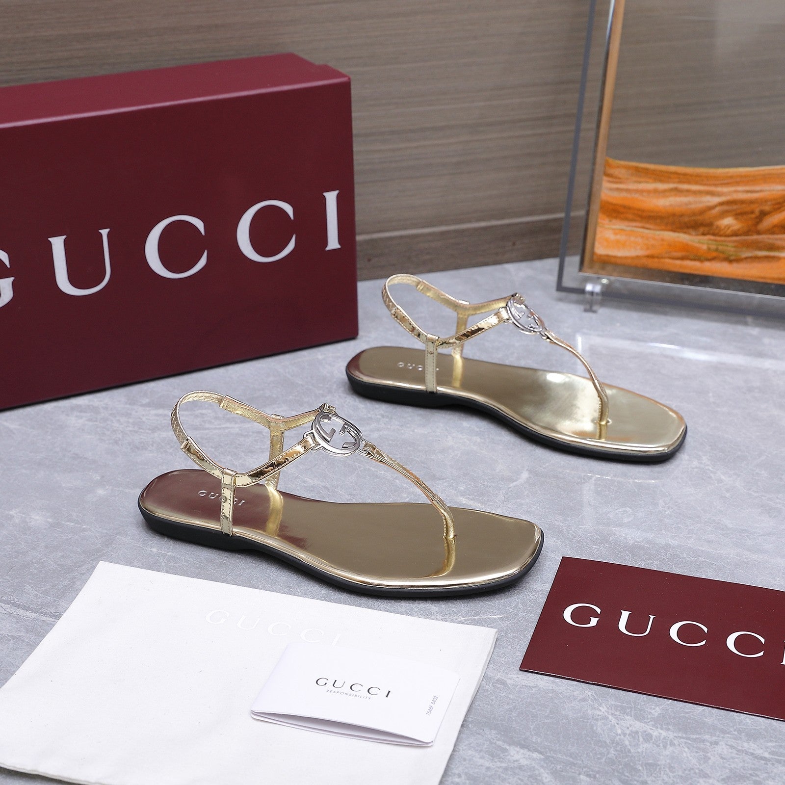 GUCCI 26S INTERLOCKING G THONG SANDALS IN GOLD CALFSKIN