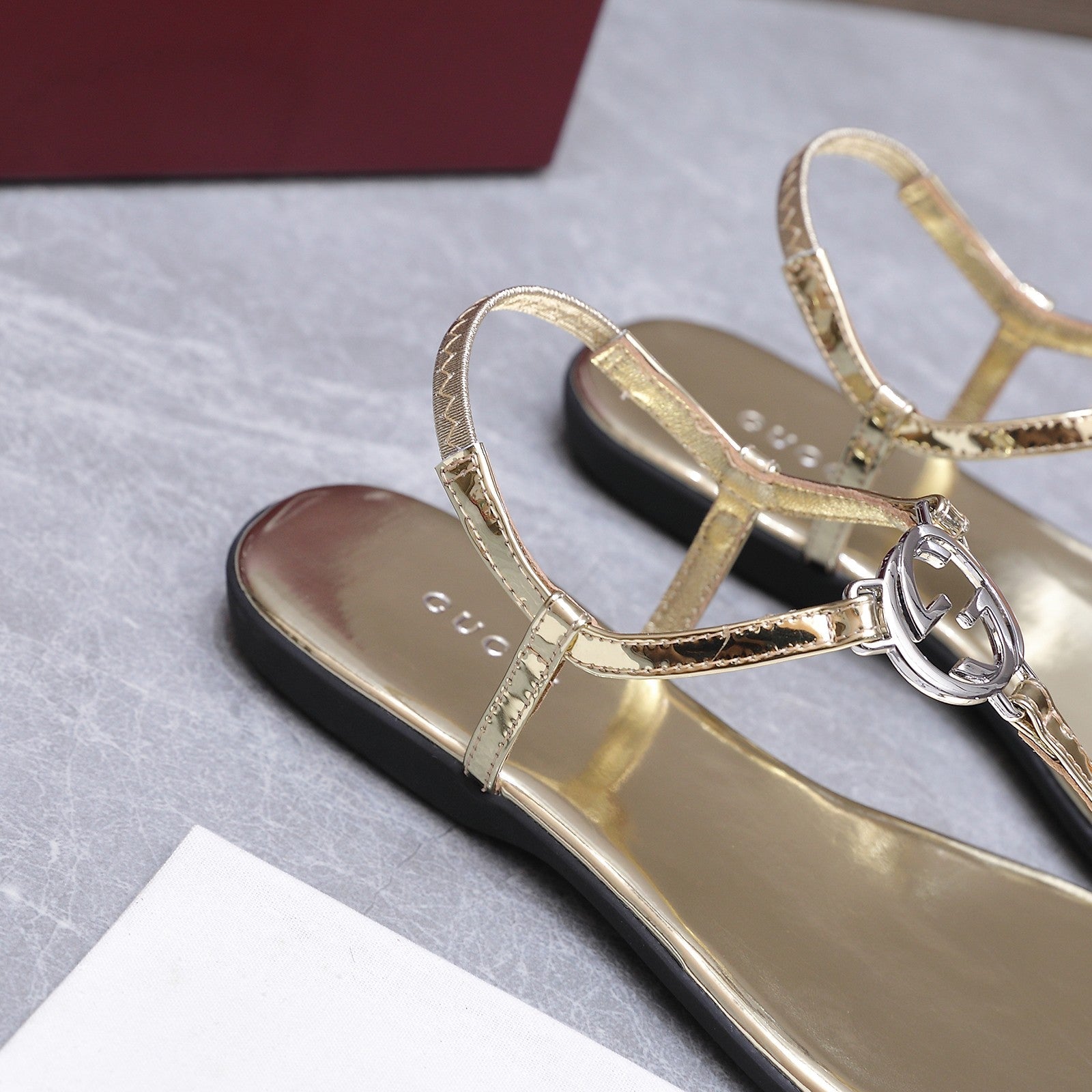 GUCCI 26S INTERLOCKING G THONG SANDALS IN GOLD CALFSKIN