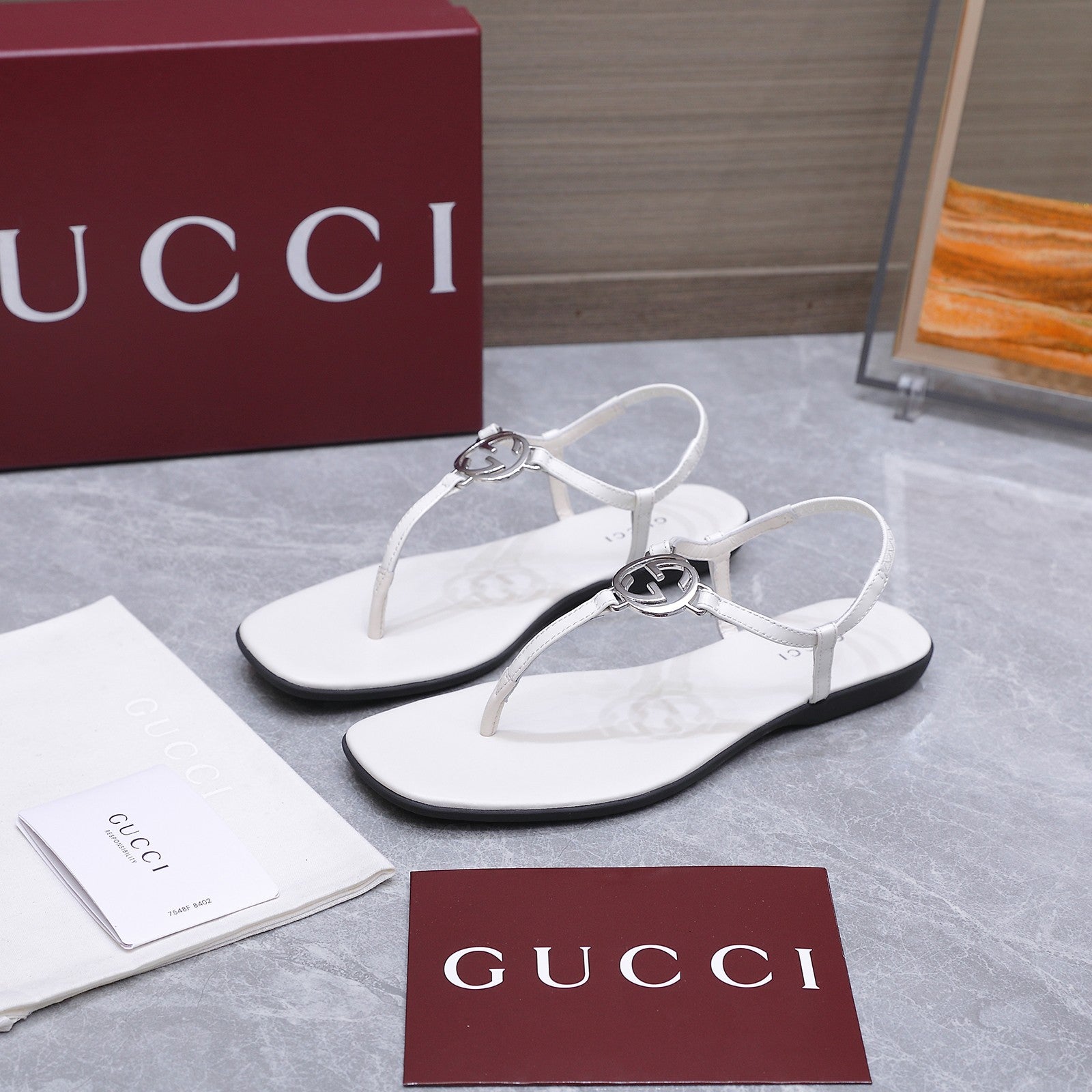 GUCCI 26S INTERLOCKING G THONG SANDALS IN WHITE CALFSKIN