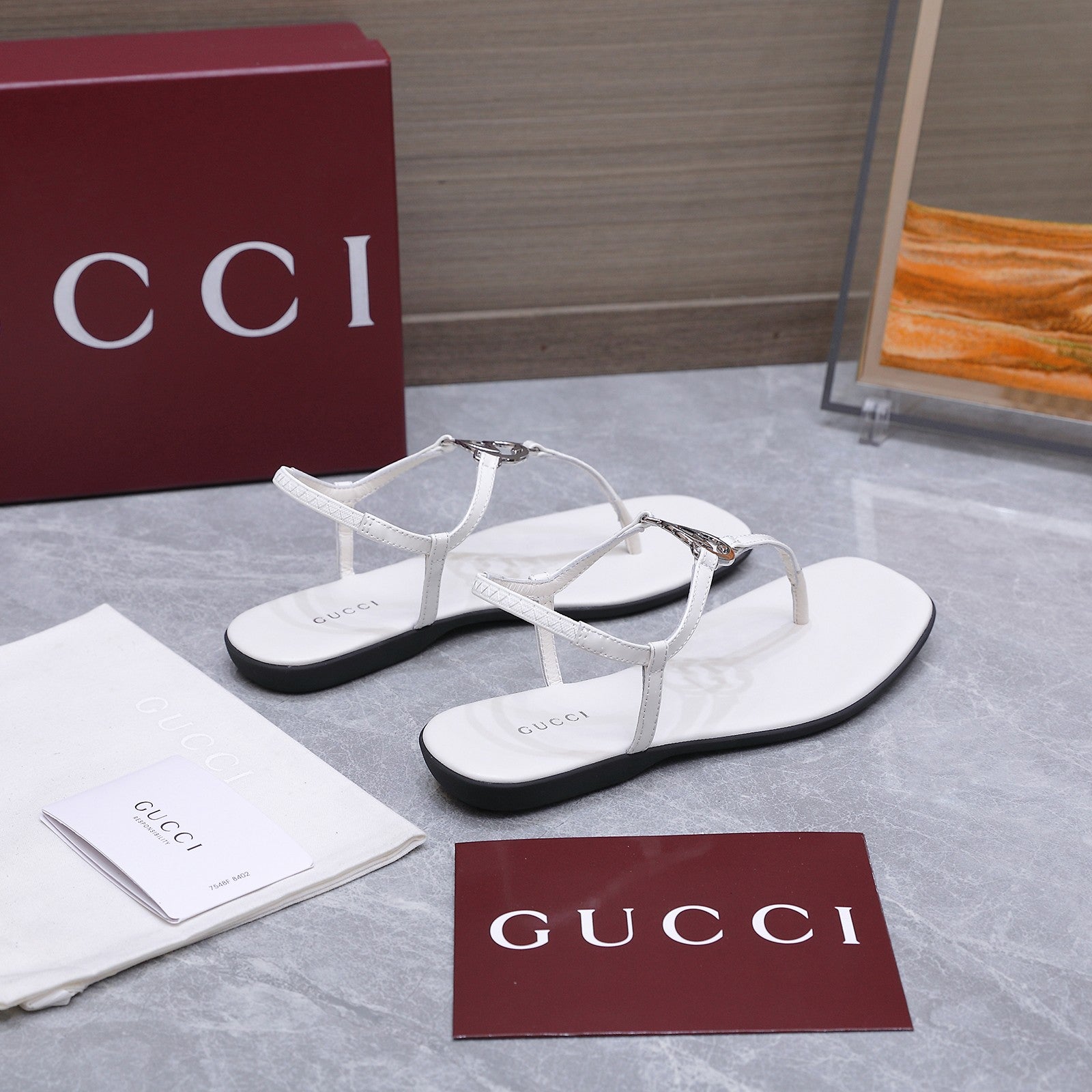 GUCCI 26S INTERLOCKING G THONG SANDALS IN WHITE CALFSKIN