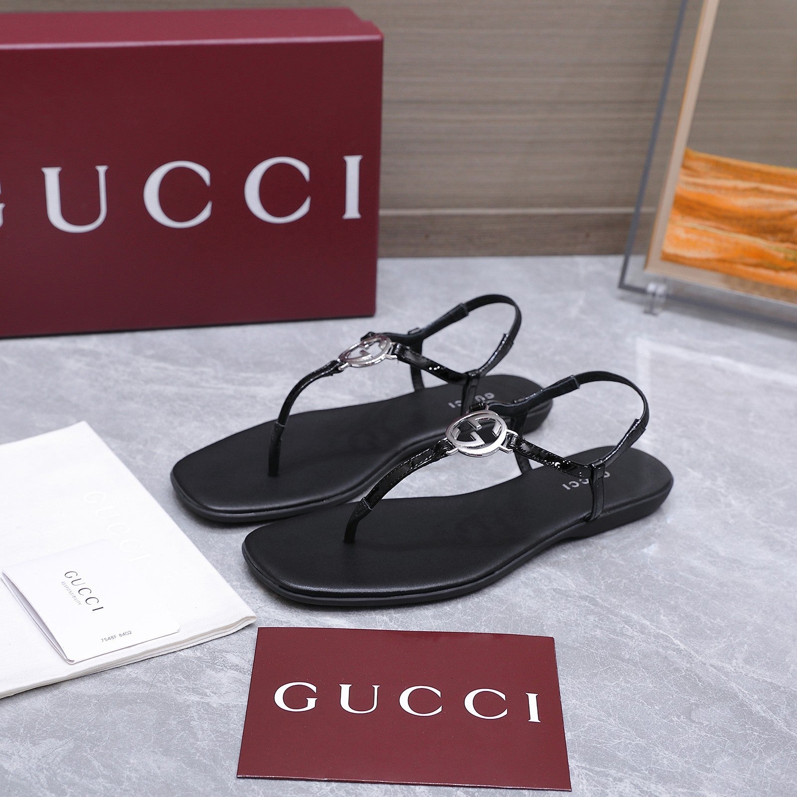 GUCCI 26S INTERLOCKING G THONG SANDALS IN BLACK CALFSKIN