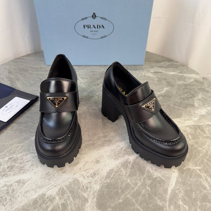 PRADA 26S HEELED LOAFERS 85 MM IN BLACK SMOOTH CALFSKIN