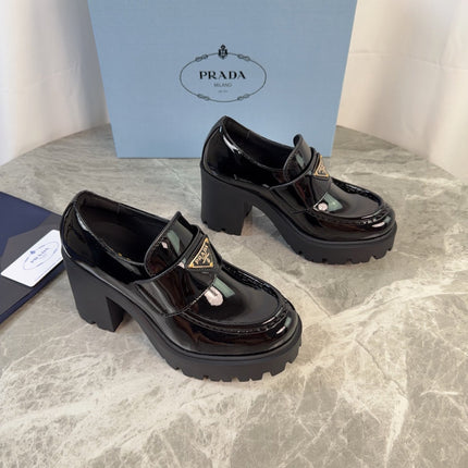 PRADA 26S HEELED LOAFERS 85 MM IN BLACK PATENT CALFSKIN