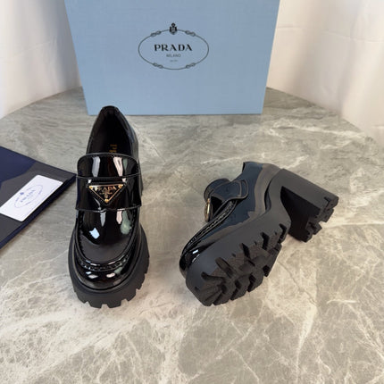 PRADA 26S HEELED LOAFERS 85 MM IN BLACK PATENT CALFSKIN