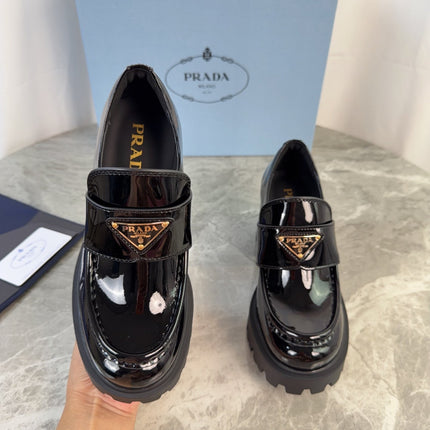 PRADA 26S HEELED LOAFERS 85 MM IN BLACK PATENT CALFSKIN