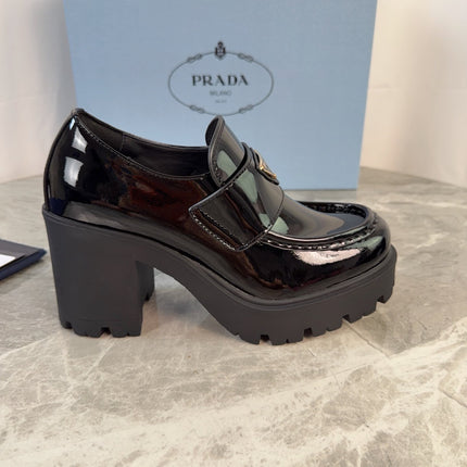 PRADA 26S HEELED LOAFERS 85 MM IN BLACK PATENT CALFSKIN