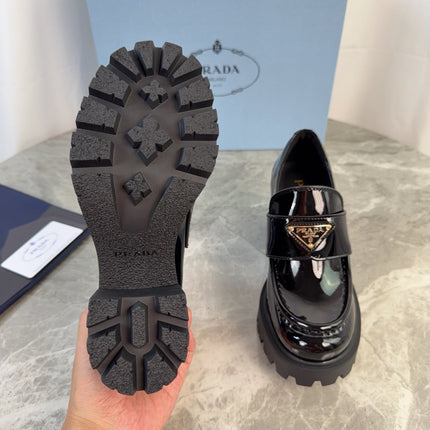 PRADA 26S HEELED LOAFERS 85 MM IN BLACK PATENT CALFSKIN