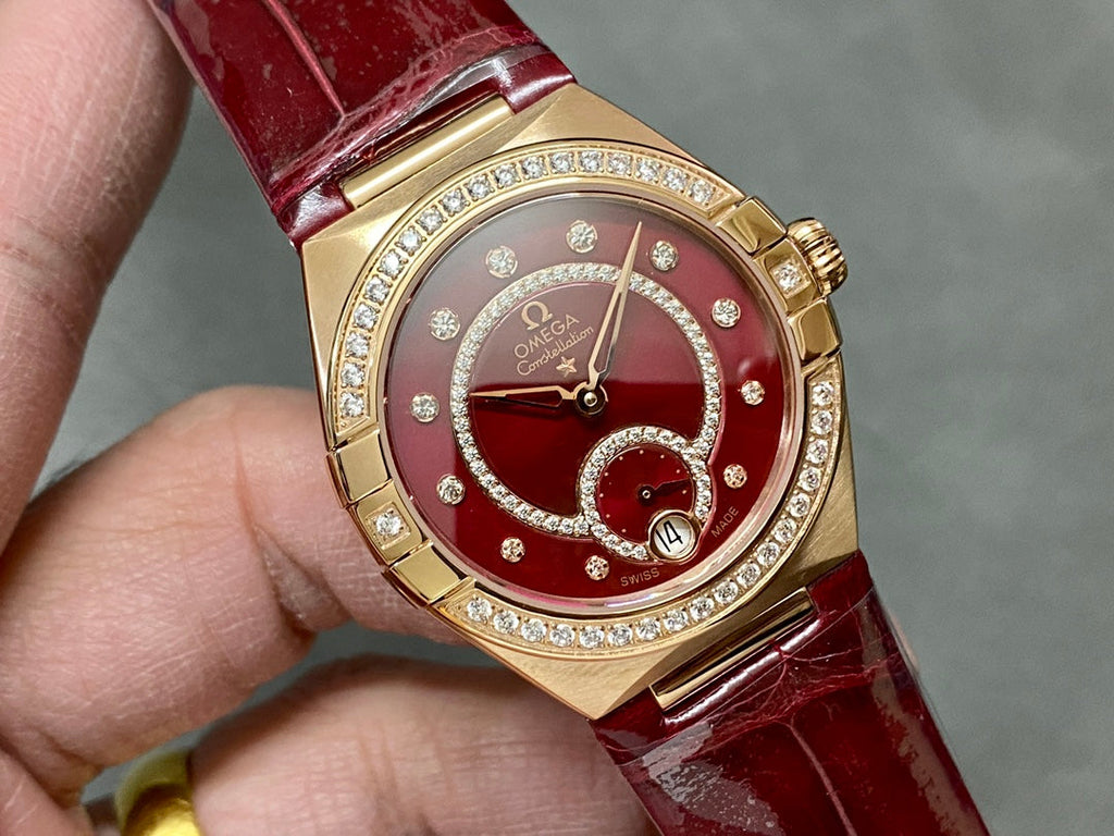 CONSTELLATION 34 MM WATCH ROSE GOLD CASE WITH WINE RED LEATHER STRAP