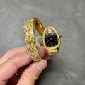SERPENTI TUBOGAS QUARTZ YELLOW GOLD BLACK DIAL