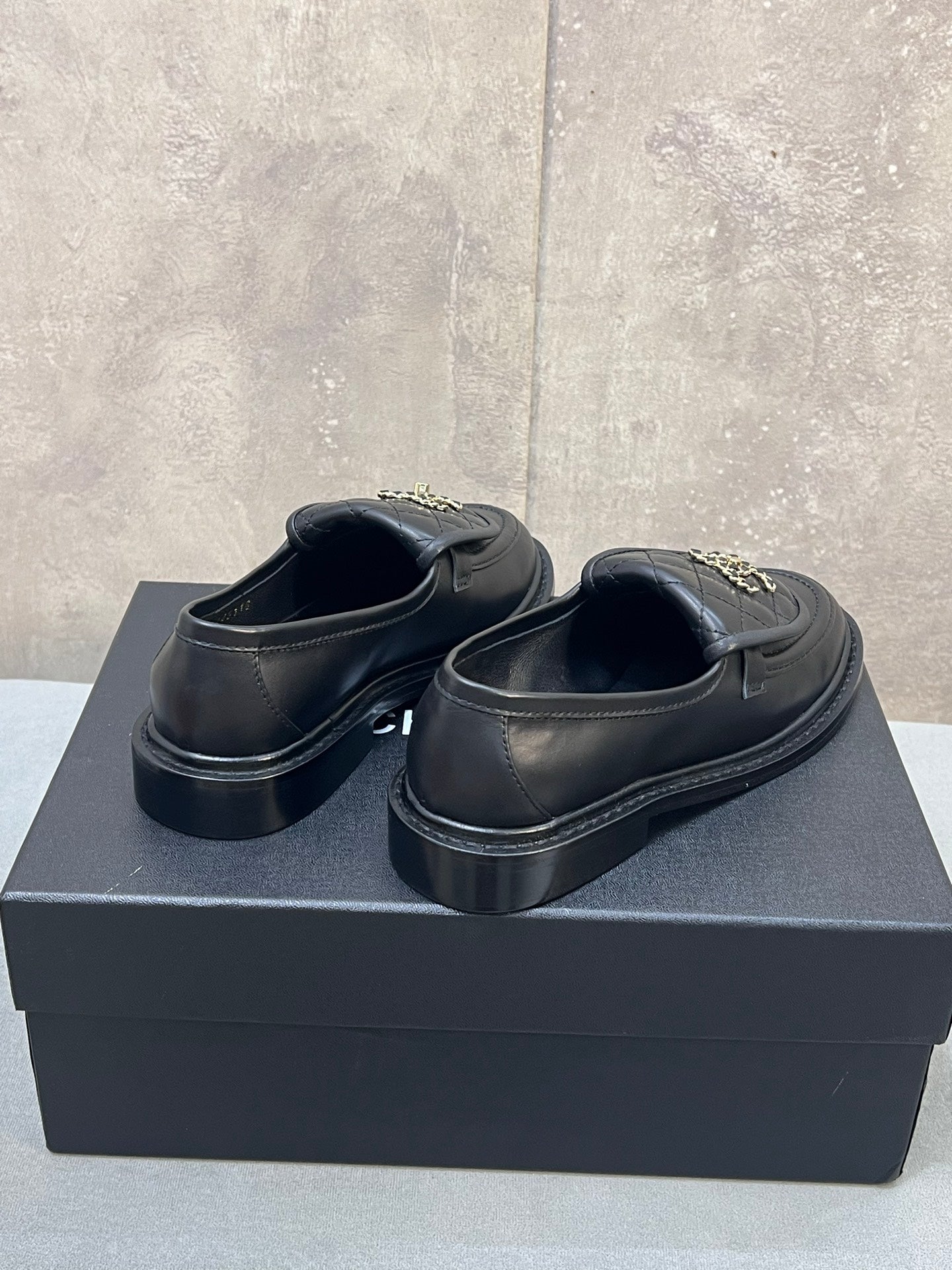 CHANEL 26S LOAFERS IN BLACK QUILTED CALFSKIN WITH CHAIN CC LOGO