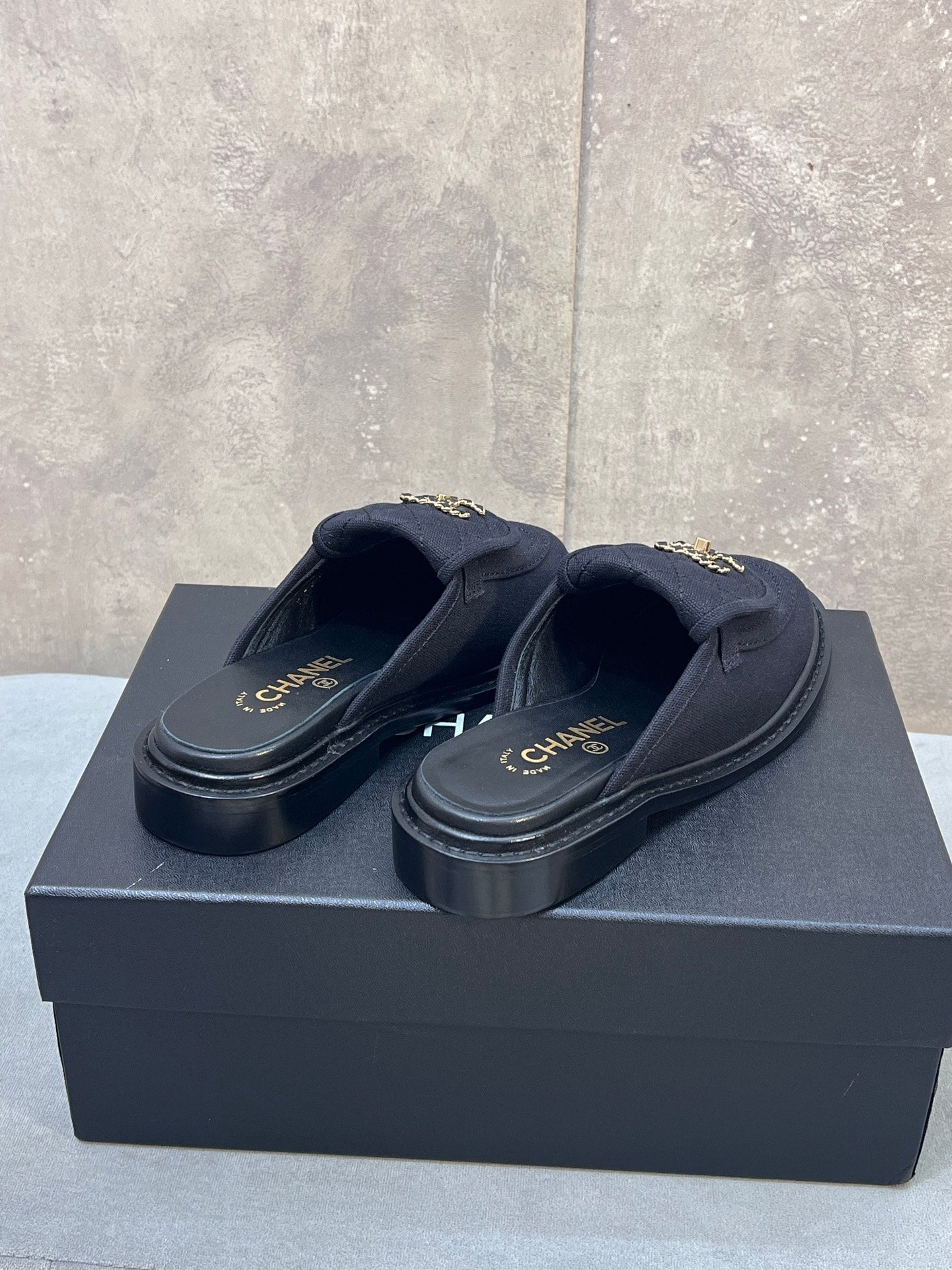 CHANEL 26S MULE LOAFERS IN BLACK CANVAS WITH QUILTED FLAP & CHAIN CC LOGO