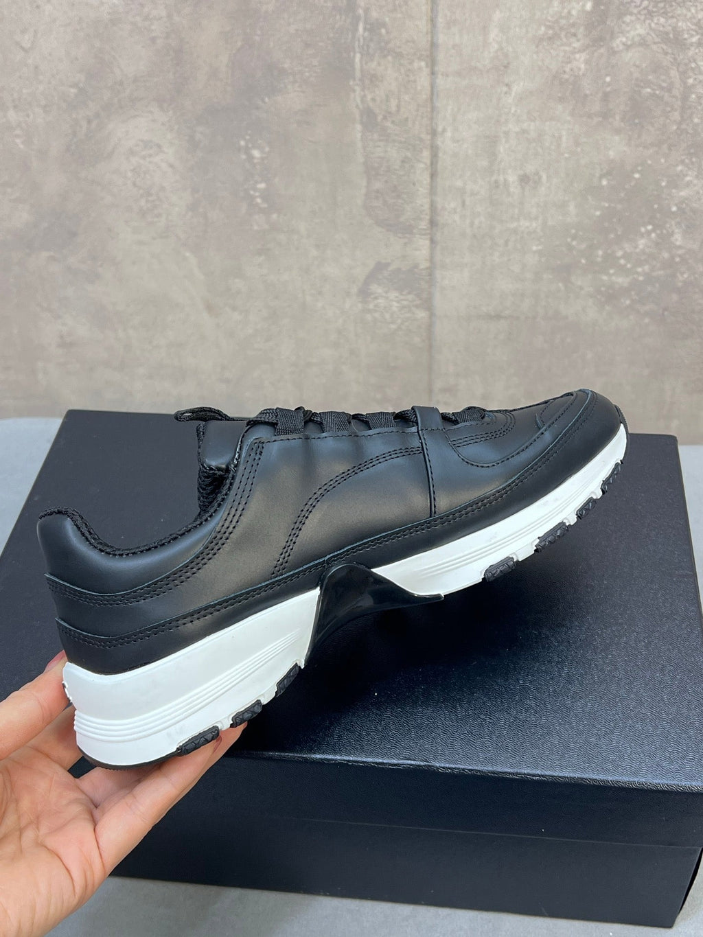 CHANEL 26S RUNNER CC LOGO SNEAKERS IN BLACK CALFSKIN