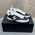 CHANEL 26S SNEAKERS IN BLACK AND WHITE QUILTED CALFSKIN CC LOGO