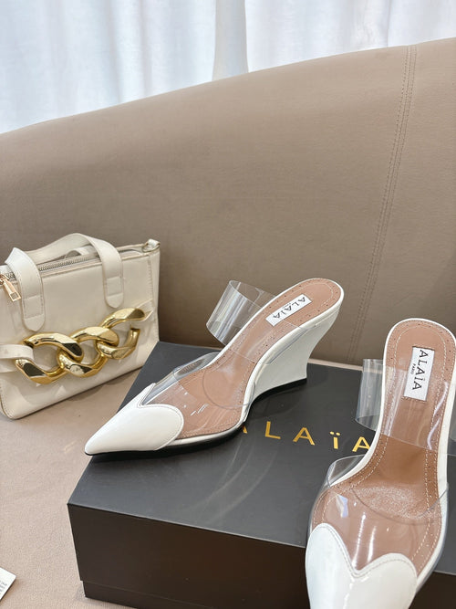 ALAIA 26S HIGH-HEEL WEDGE MULES 95 MM IN WHITE GLOSSY CALFSKIN