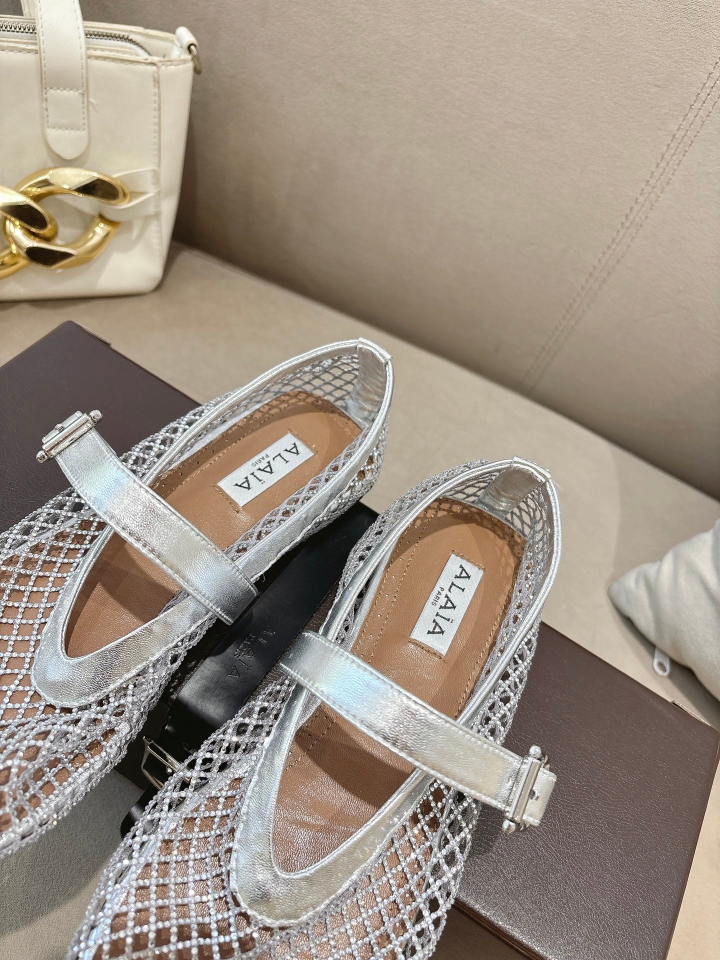 ALAIA 26S MESH FLATS IN SILVER LAMBSKIN