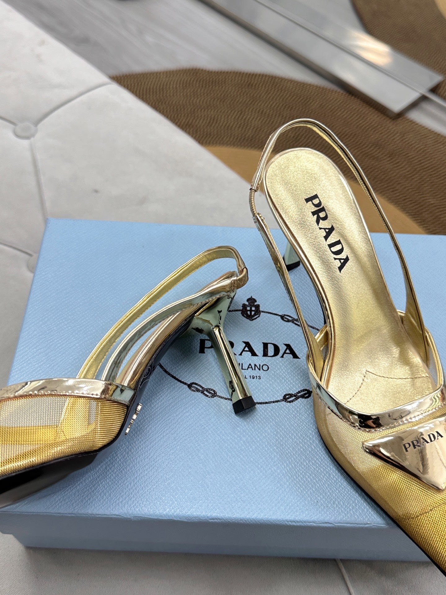PRADA 25S TRIANGLE LOGO SLINGBACK PUMPS IN GOLD MESH FABRIC