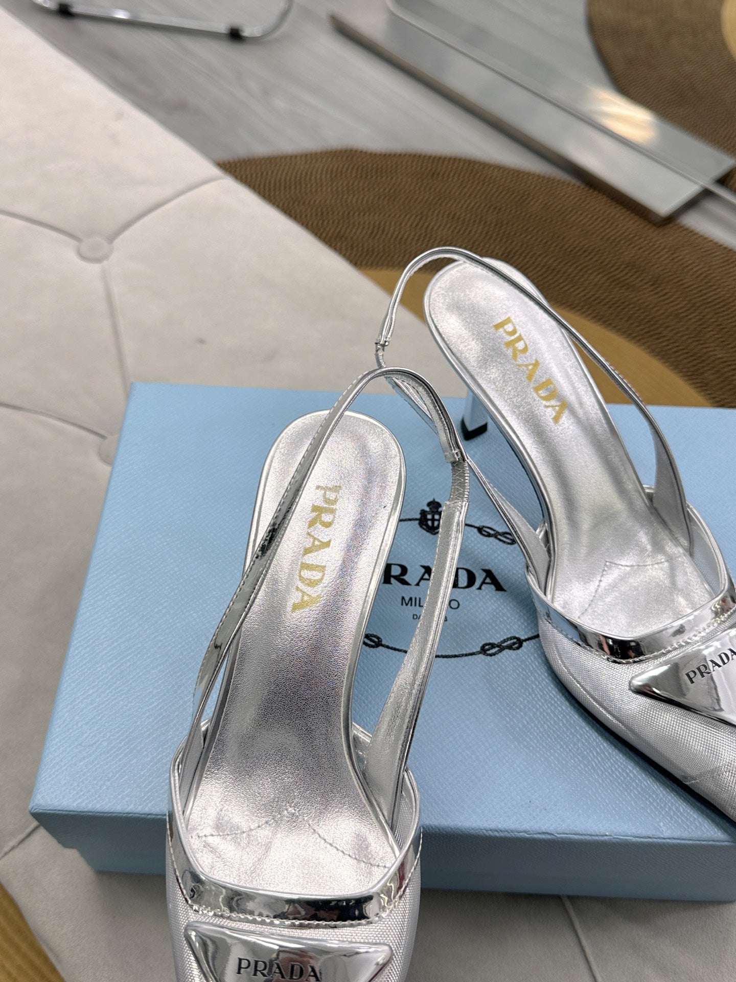 PRADA 25S TRIANGLE LOGO SLINGBACK PUMPS IN SILVER MESH FABRIC