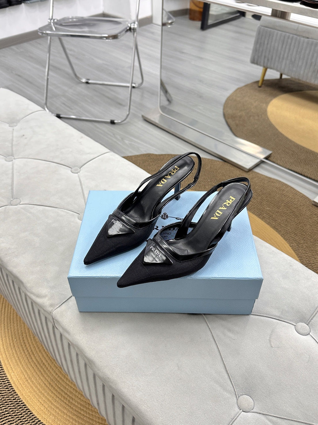 PRADA 25S TRIANGLE LOGO SLINGBACK PUMPS IN BLACK MESH FABRIC